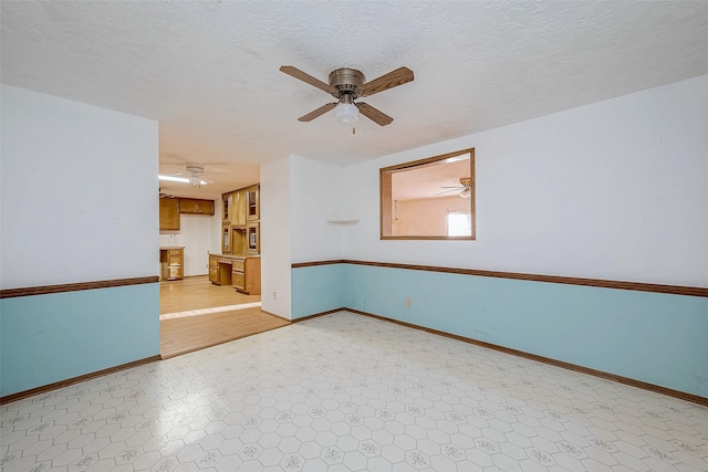 31002 Misty Meadow Dr, Magnolia, TX 77354 - unfurnished room featuring ceiling fan and baseboards
