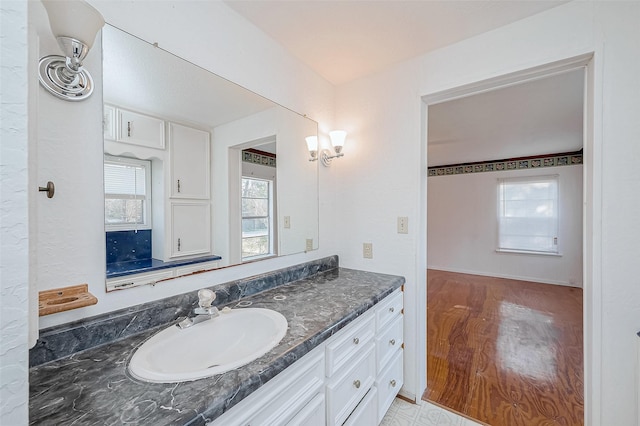 31002 Misty Meadow Dr, Magnolia, TX 77354 - bathroom featuring vanity, healthy amount of natural light, and wood finished floors