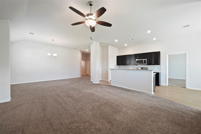 6502 Blimp Base Blvd, Hitchcock, TX 77563 - unfurnished living room with ceiling fan, a chandelier, light colored carpet, recessed lighting, and baseboards