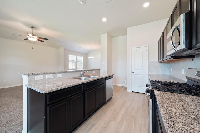 6502 Blimp Base Blvd, Hitchcock, TX 77563 - kitchen with stainless steel appliances, a sink, backsplash, baseboards, and recessed lighting