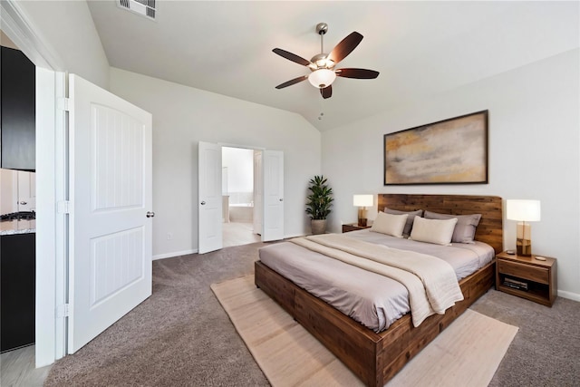 6502 Blimp Base Blvd, Hitchcock, TX 77563 - bedroom featuring light carpet, lofted ceiling, baseboards, and ensuite bath