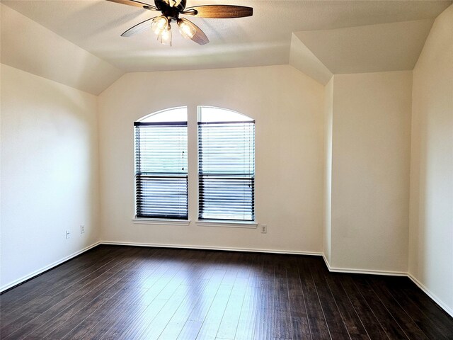 8039 Ellinger Ln, Houston, TX 77040 - spare room with ceiling fan, lofted ceiling, dark wood-style flooring, and baseboards