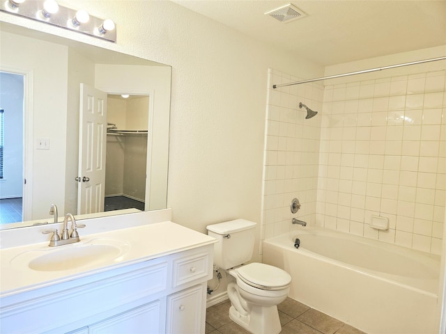 8039 Ellinger Ln, Houston, TX 77040 - full bath with toilet, vanity, bathtub / shower combination, tile patterned flooring, and a walk in closet
