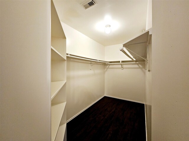 8039 Ellinger Ln, Houston, TX 77040 - walk in closet featuring dark wood-type flooring