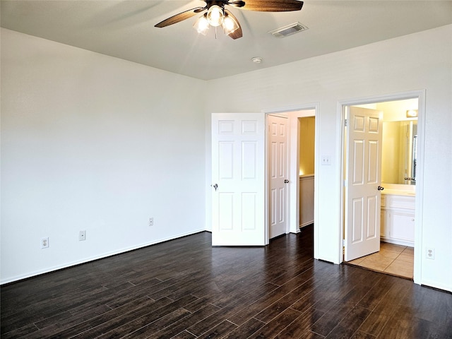 8039 Ellinger Ln, Houston, TX 77040 - unfurnished bedroom with wood finished floors, connected bathroom, ceiling fan, and baseboards