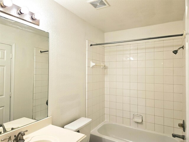 8039 Ellinger Ln, Houston, TX 77040 - bathroom with shower / washtub combination, vanity, toilet, a textured ceiling, and a textured wall