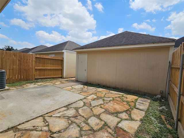 8039 Ellinger Ln, Houston, TX 77040 - fenced backyard featuring a patio area and central AC