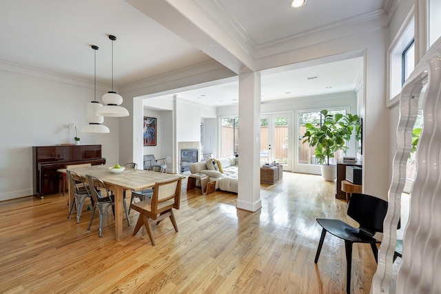 2306 Mcduffie St, Houston, TX 77019 - dining room featuring light wood-style flooring, ornamental molding, baseboards, and recessed lighting