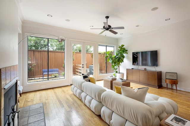 2306 Mcduffie St, Houston, TX 77019 - living area featuring a ceiling fan, healthy amount of natural light, wood-type flooring, crown molding, and recessed lighting