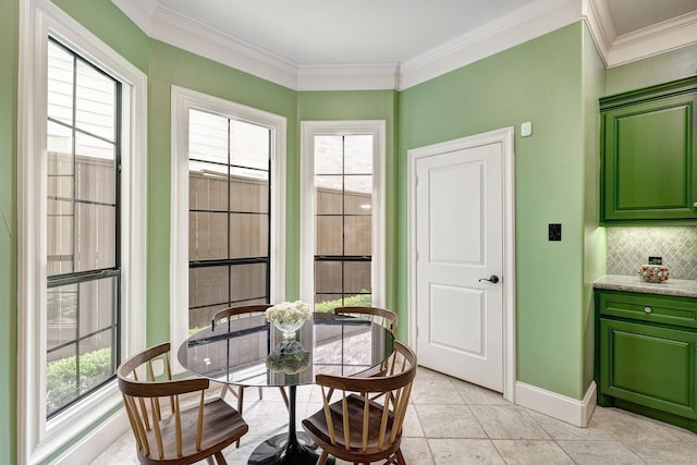 2306 Mcduffie St, Houston, TX 77019 - dining area with baseboards, plenty of natural light, ornamental molding, and light tile patterned floors