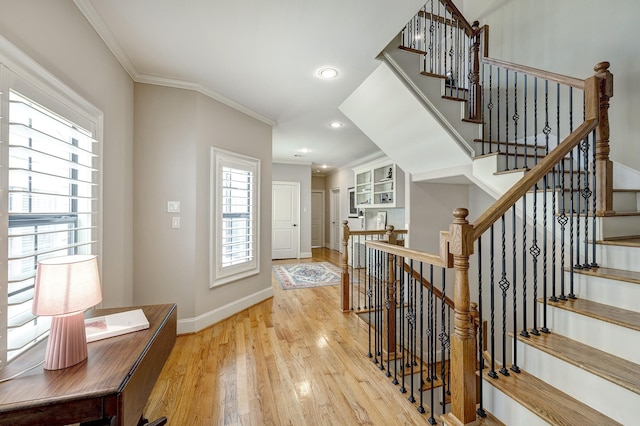 2306 Mcduffie St, Houston, TX 77019 - entrance foyer featuring light wood-style flooring, baseboards, ornamental molding, recessed lighting, and stairs