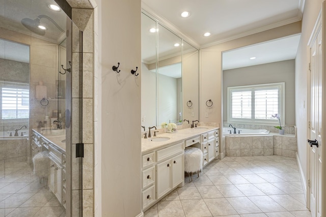 2306 Mcduffie St, Houston, TX 77019 - full bath featuring crown molding, a garden tub, double vanity, tile patterned flooring, and recessed lighting