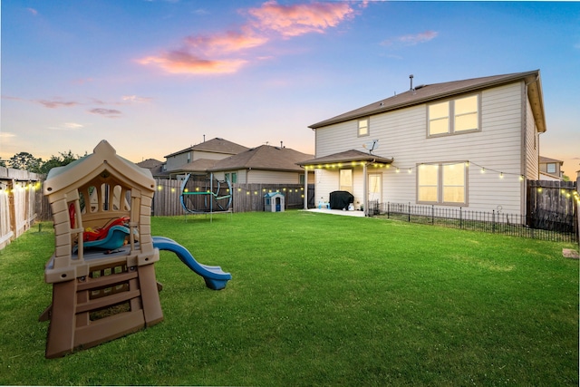 14619 Jasper Stream Ct, Houston, TX 77069 - back of property at dusk with a playground