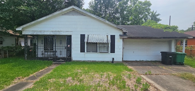 4838 Marietta Ln, Houston, TX 77021 - view of front of house with a front yard, driveway, an attached garage, and a porch