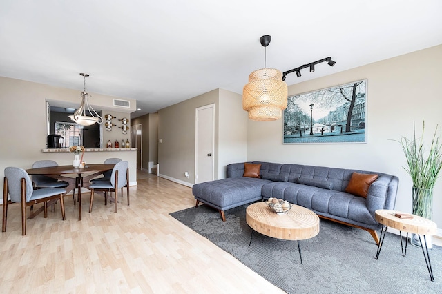 2011 Winrock Blvd Unit 172, Houston, TX 77057 - living room featuring light wood-style floors and baseboards