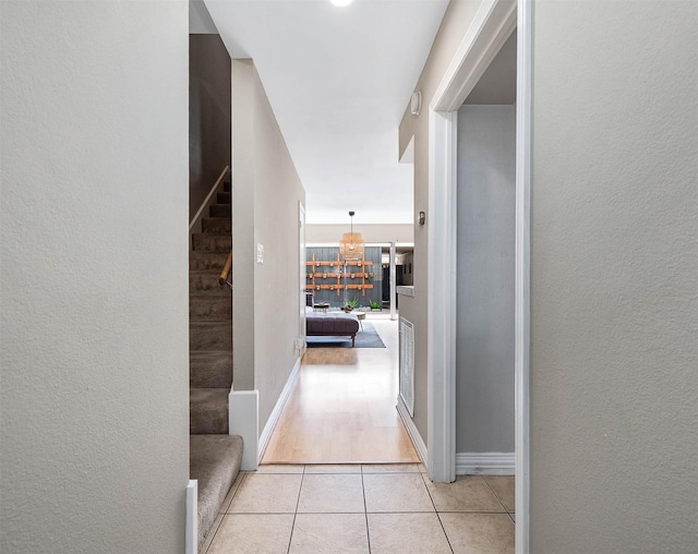 2011 Winrock Blvd Unit 172, Houston, TX 77057 - hallway with stairs, light tile patterned floors, and a textured wall