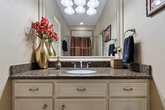 5520 Mcculloch Cir, Houston, TX 77056 - bathroom featuring vanity, a shower with shower curtain, and a textured wall