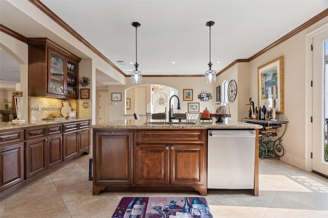 5520 Mcculloch Cir, Houston, TX 77056 - kitchen with dishwasher, a sink, arched walkways, decorative backsplash, and light tile patterned floors