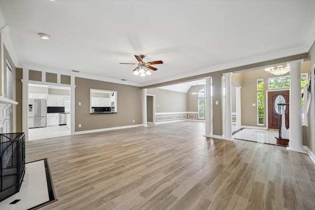 42 Stalybridge St, Sugar Land, TX 77479 - unfurnished living room with decorative columns, ceiling fan, ornamental molding, light wood finished floors, and a chandelier