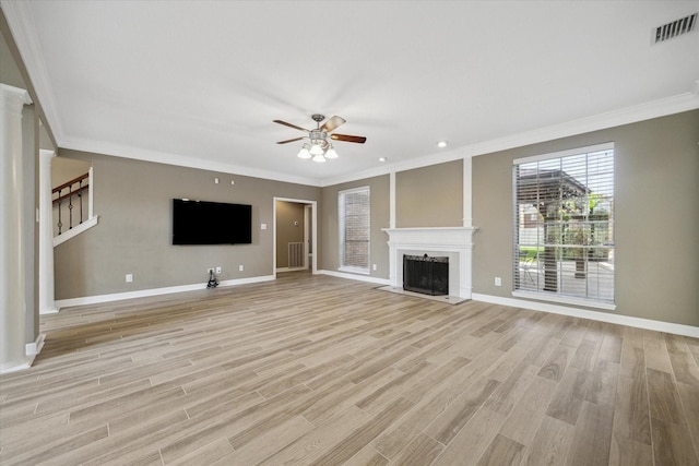 42 Stalybridge St, Sugar Land, TX 77479 - unfurnished living room featuring crown molding, ceiling fan, light wood finished floors, and baseboards
