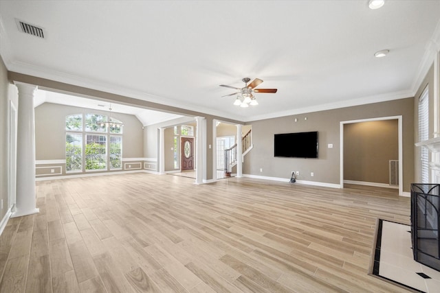42 Stalybridge St, Sugar Land, TX 77479 - unfurnished living room with decorative columns, ceiling fan, light wood finished floors, crown molding, and a chandelier