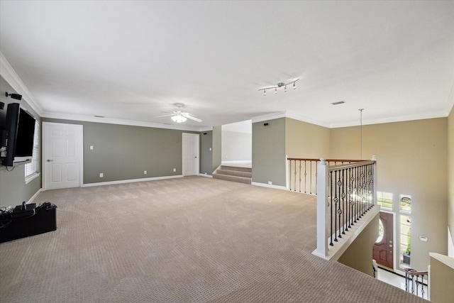 42 Stalybridge St, Sugar Land, TX 77479 - unfurnished living room featuring ornamental molding, plenty of natural light, light colored carpet, a ceiling fan, and baseboards