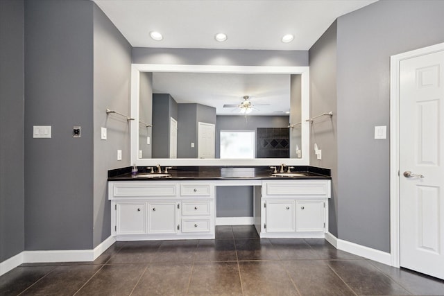42 Stalybridge St, Sugar Land, TX 77479 - bathroom with double vanity, ceiling fan, baseboards, and a tile shower