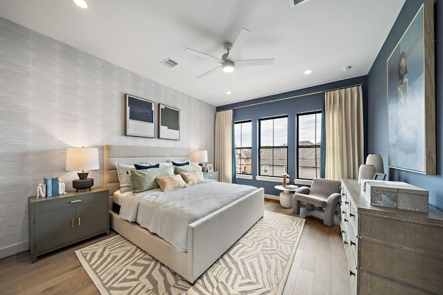 1720 Sedola Ln, Houston, TX 77055 - bedroom with wallpapered walls, hardwood / wood-style flooring, baseboards, recessed lighting, and ceiling fan