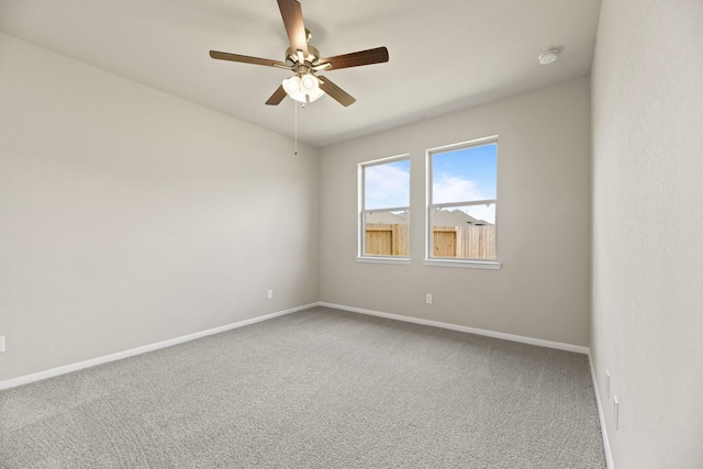 18810 Lucas Michael Way, New Caney, TX 77357 - carpeted spare room with baseboards, ceiling fan, and a smoke detector