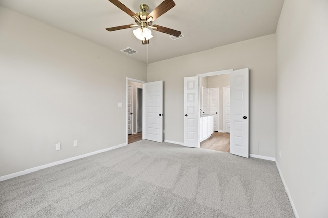18810 Lucas Michael Way, New Caney, TX 77357 - unfurnished bedroom with light carpet, baseboards, and ensuite bath
