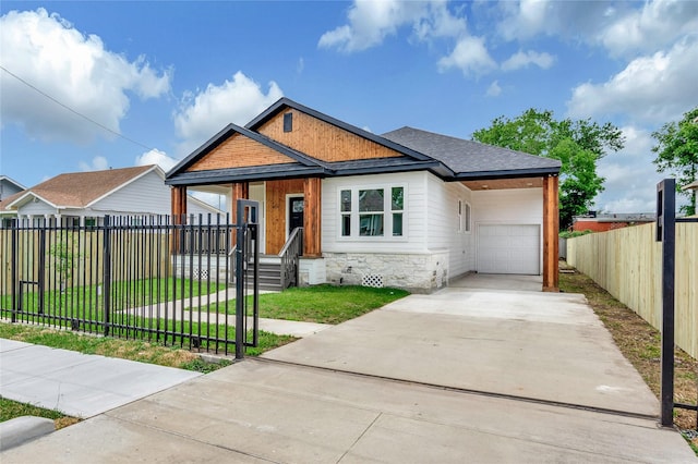 4014 Linder St, Houston, TX 77026 - view of front of home with stone siding, concrete driveway, roof with shingles, and a porch