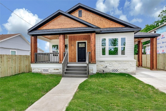 4014 Linder St, Houston, TX 77026 - view of front of home featuring a porch and stone siding