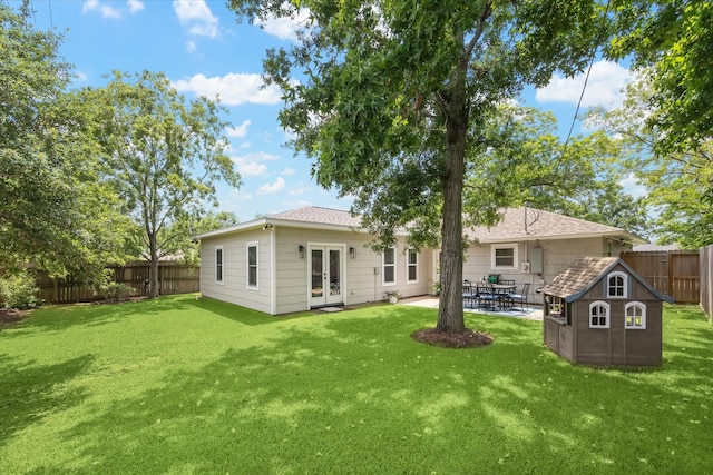 810 Nashua St, Houston, TX 77008 - back of property featuring french doors, a patio, and an outbuilding