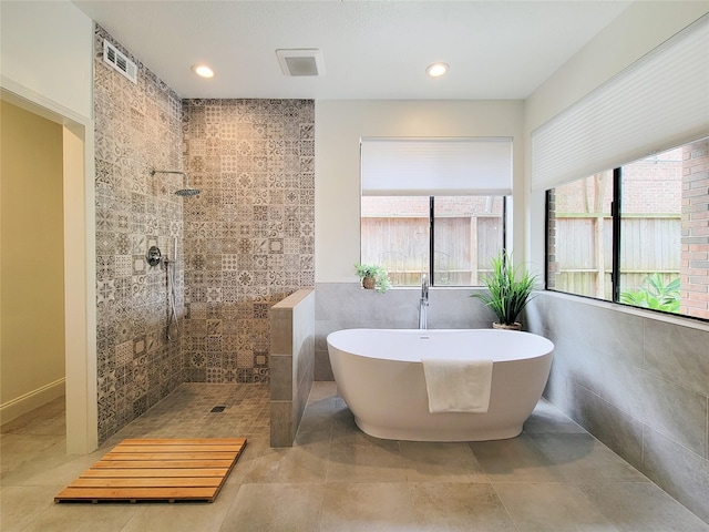 4900 Willow St, Bellaire, TX 77401 - bathroom with walk in shower and a freestanding tub