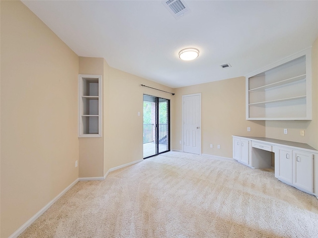 4900 Willow St, Bellaire, TX 77401 - unfurnished living room featuring baseboards and light carpet