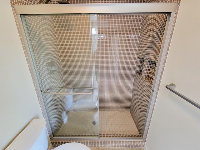 4900 Willow St, Bellaire, TX 77401 - bathroom featuring toilet and a shower stall
