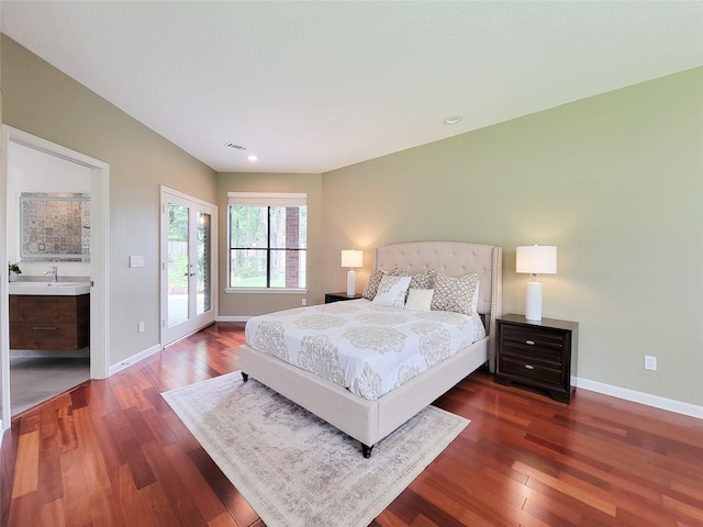 4900 Willow St, Bellaire, TX 77401 - bedroom featuring wood finished floors, access to outside, baseboards, and a sink