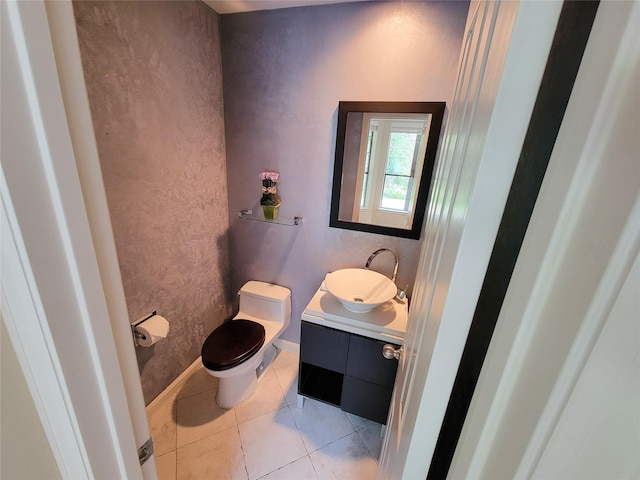 4900 Willow St, Bellaire, TX 77401 - bathroom featuring vanity, toilet, tile patterned flooring, and baseboards