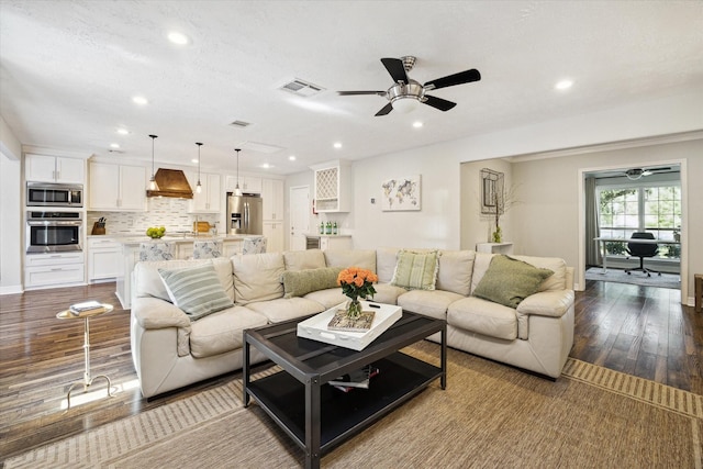 11102 Hillcroft St, Houston, TX 77096 - living area featuring a ceiling fan, recessed lighting, dark wood-style floors, and baseboards