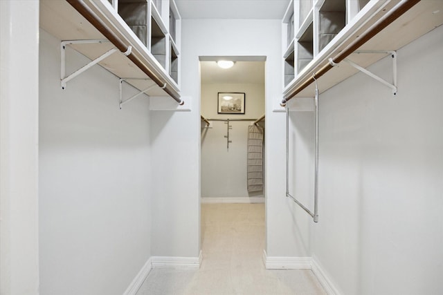 11102 Hillcroft St, Houston, TX 77096 - walk in closet featuring carpet flooring