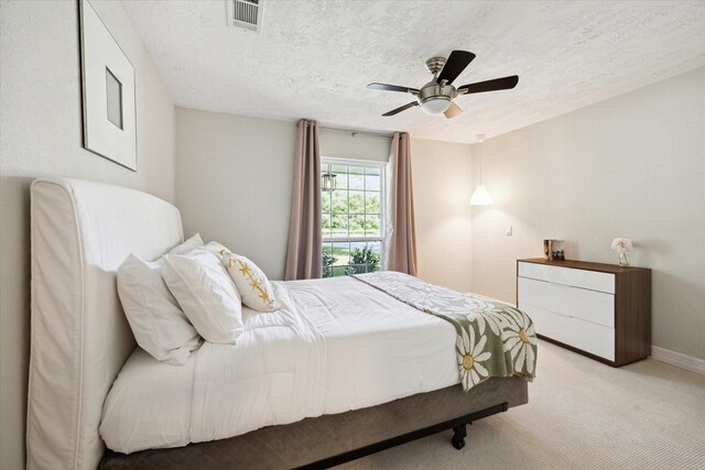 11102 Hillcroft St, Houston, TX 77096 - carpeted bedroom with a textured ceiling, a ceiling fan, and baseboards