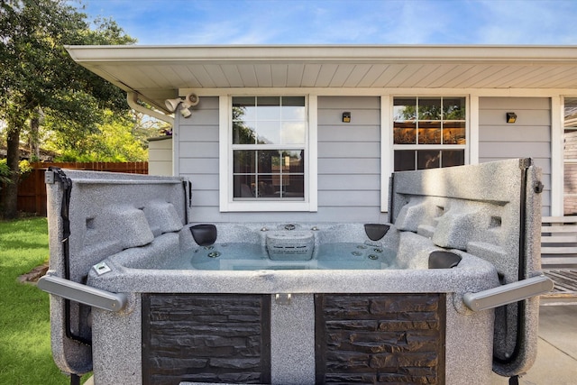 11102 Hillcroft St, Houston, TX 77096 - view of patio with a hot tub and a garage