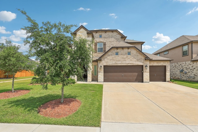 3403 Majestic Pine Ln, Rosenberg, TX 77471 - view of front of property with an attached garage, a front yard, concrete driveway, and stone siding