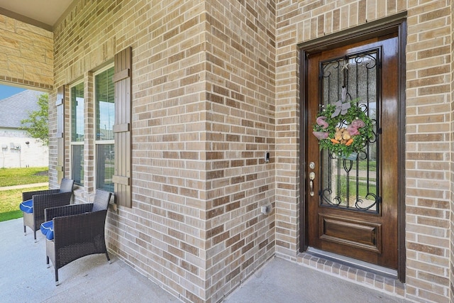 3403 Majestic Pine Ln, Rosenberg, TX 77471 - doorway to property featuring brick siding and a porch