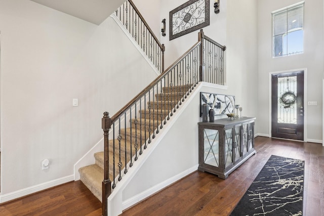 3403 Majestic Pine Ln, Rosenberg, TX 77471 - entryway with wood-type flooring, a high ceiling, plenty of natural light, and baseboards