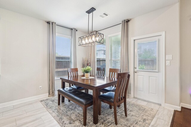 3403 Majestic Pine Ln, Rosenberg, TX 77471 - dining space with healthy amount of natural light, baseboards, and light wood finished floors
