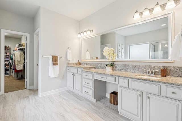 3403 Majestic Pine Ln, Rosenberg, TX 77471 - bathroom with double vanity, a shower stall, and a walk in closet