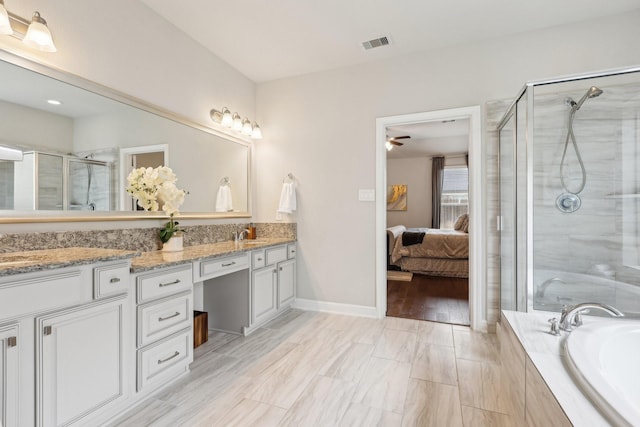 3403 Majestic Pine Ln, Rosenberg, TX 77471 - full bathroom with double vanity, ensuite bathroom, a shower stall, a bath, and a ceiling fan