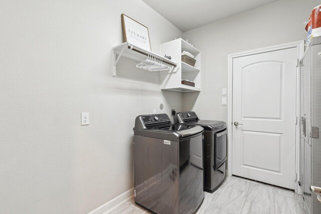 3403 Majestic Pine Ln, Rosenberg, TX 77471 - laundry area with washing machine and dryer and light marble finish flooring