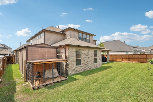 3403 Majestic Pine Ln, Rosenberg, TX 77471 - rear view of property with brick siding, a shingled roof, and an outbuilding